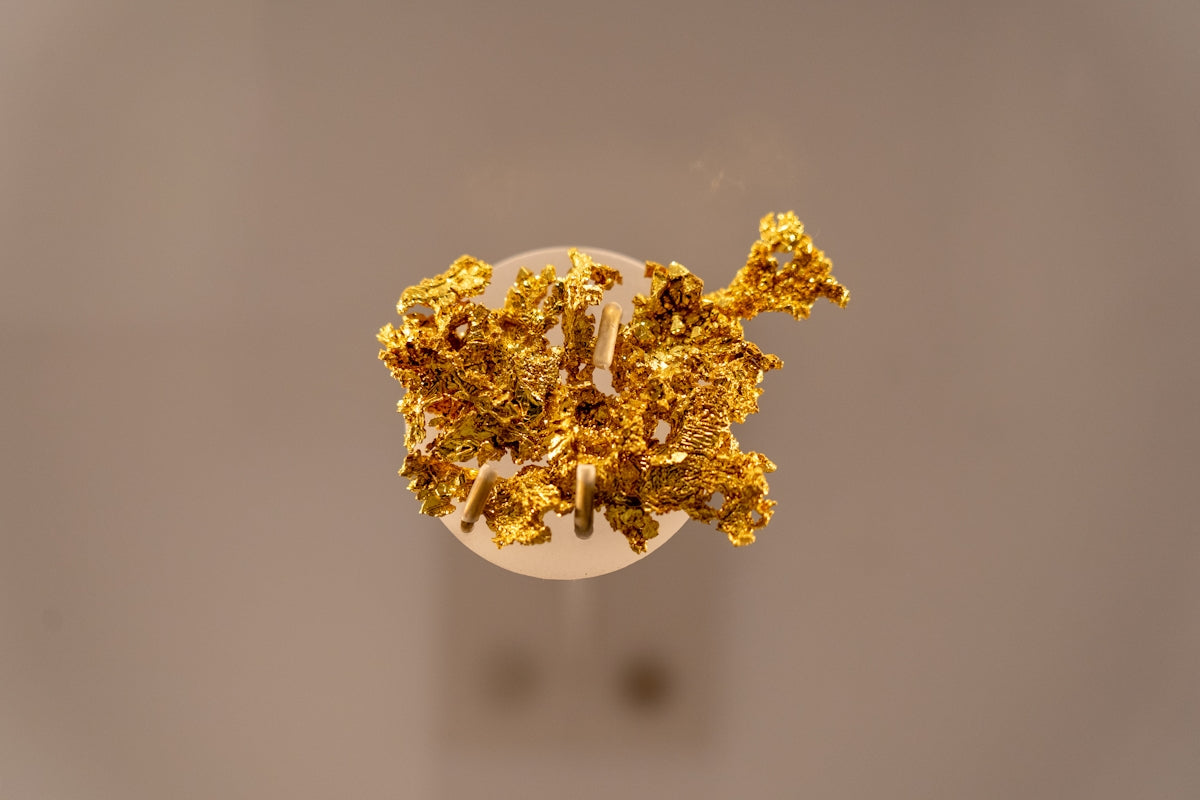 a bunch of gold nuggets sitting on top of a table