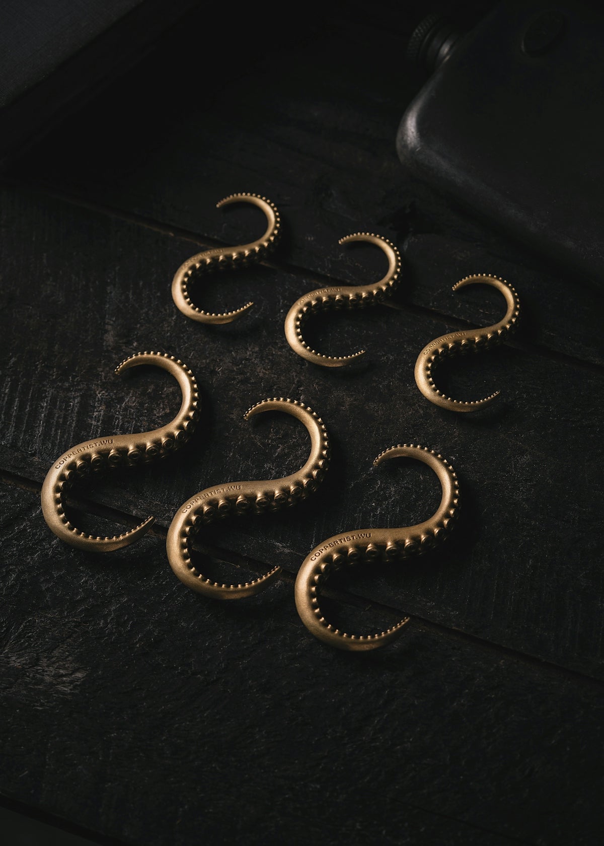 a group of gold rings sitting on top of a table