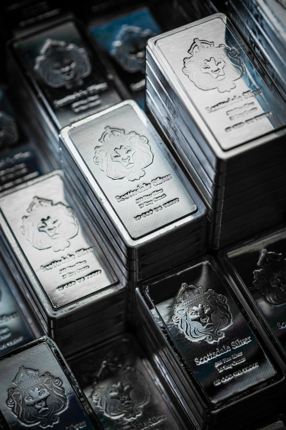 A pile of silver bars sitting on top of each other