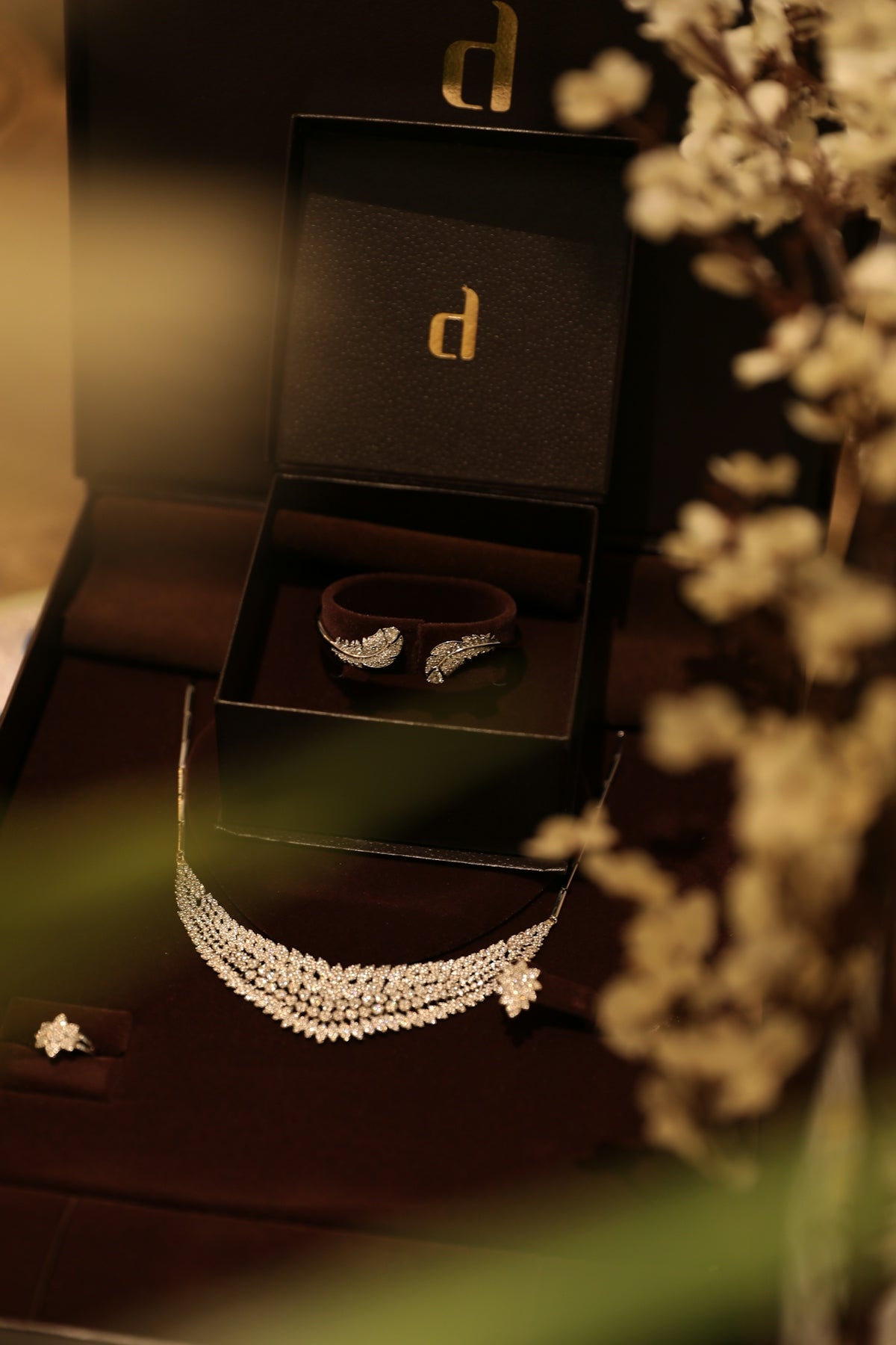 Elegant jewelry is displayed in a luxurious box.