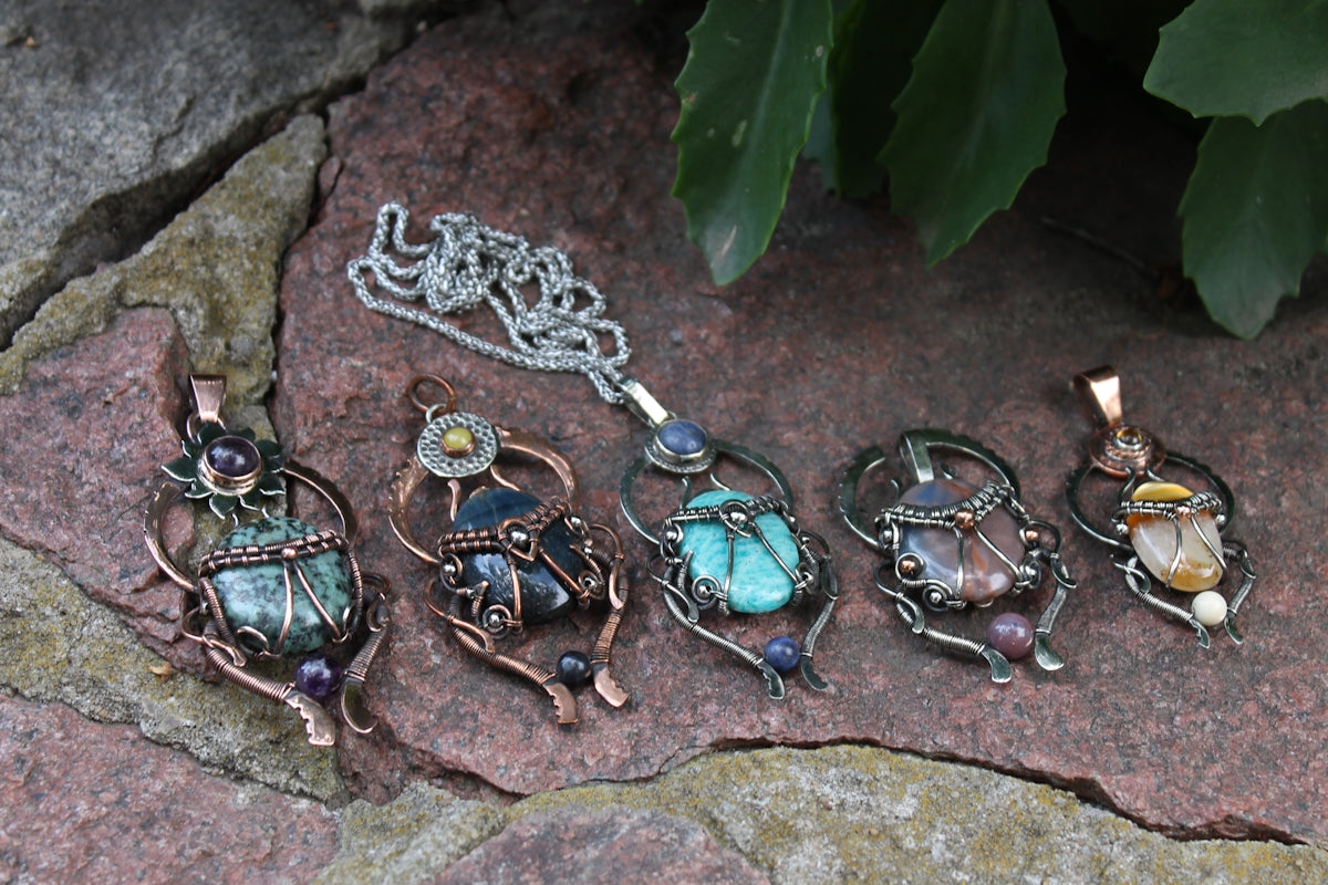 Five handcrafted pendants with gemstones and wire wrapping