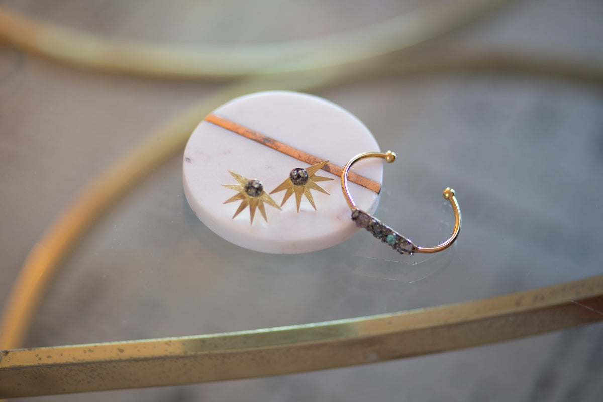 pair of gold-colored star stud earrings