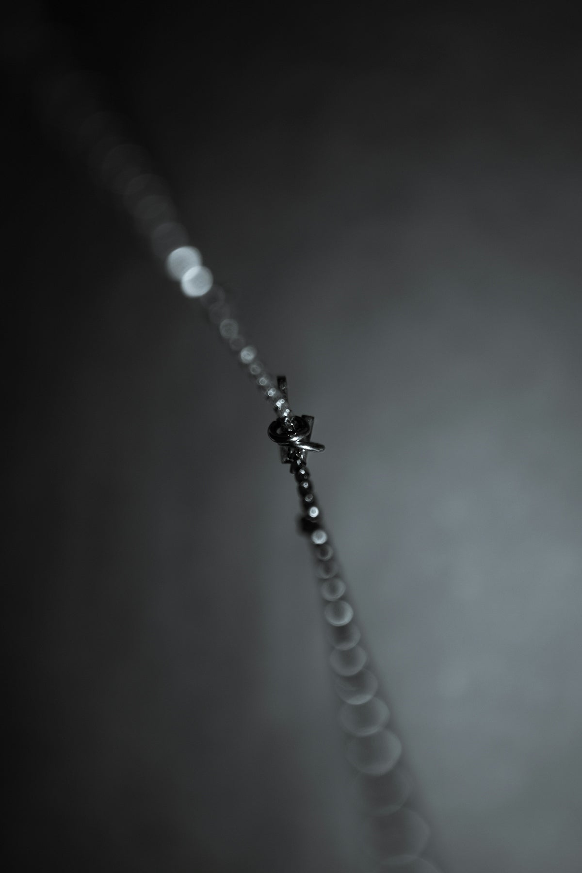 water droplets on silver chain