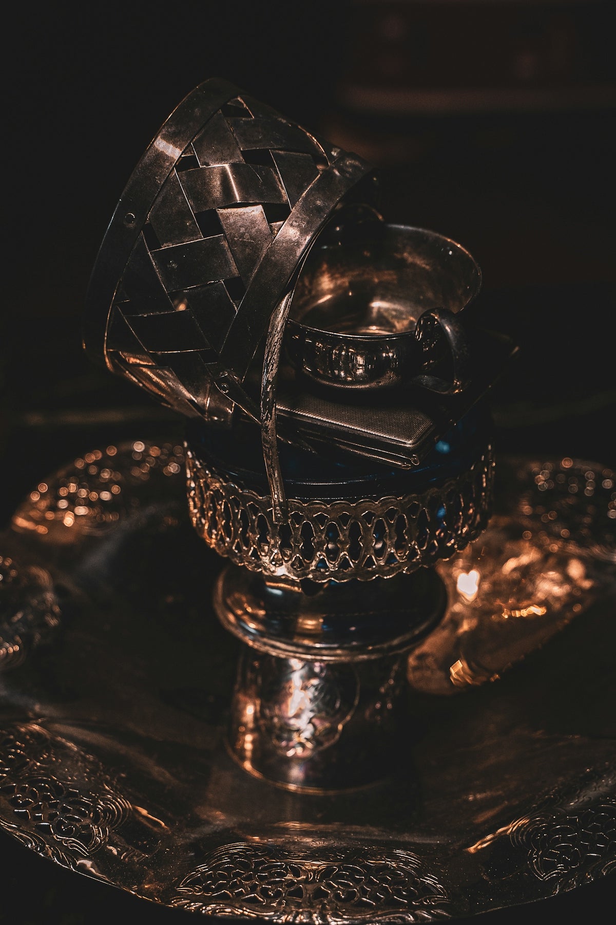 silver and black trophy on black table