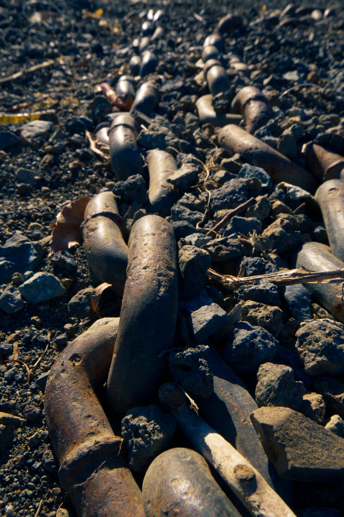 a bunch of rusty chains laying on the ground