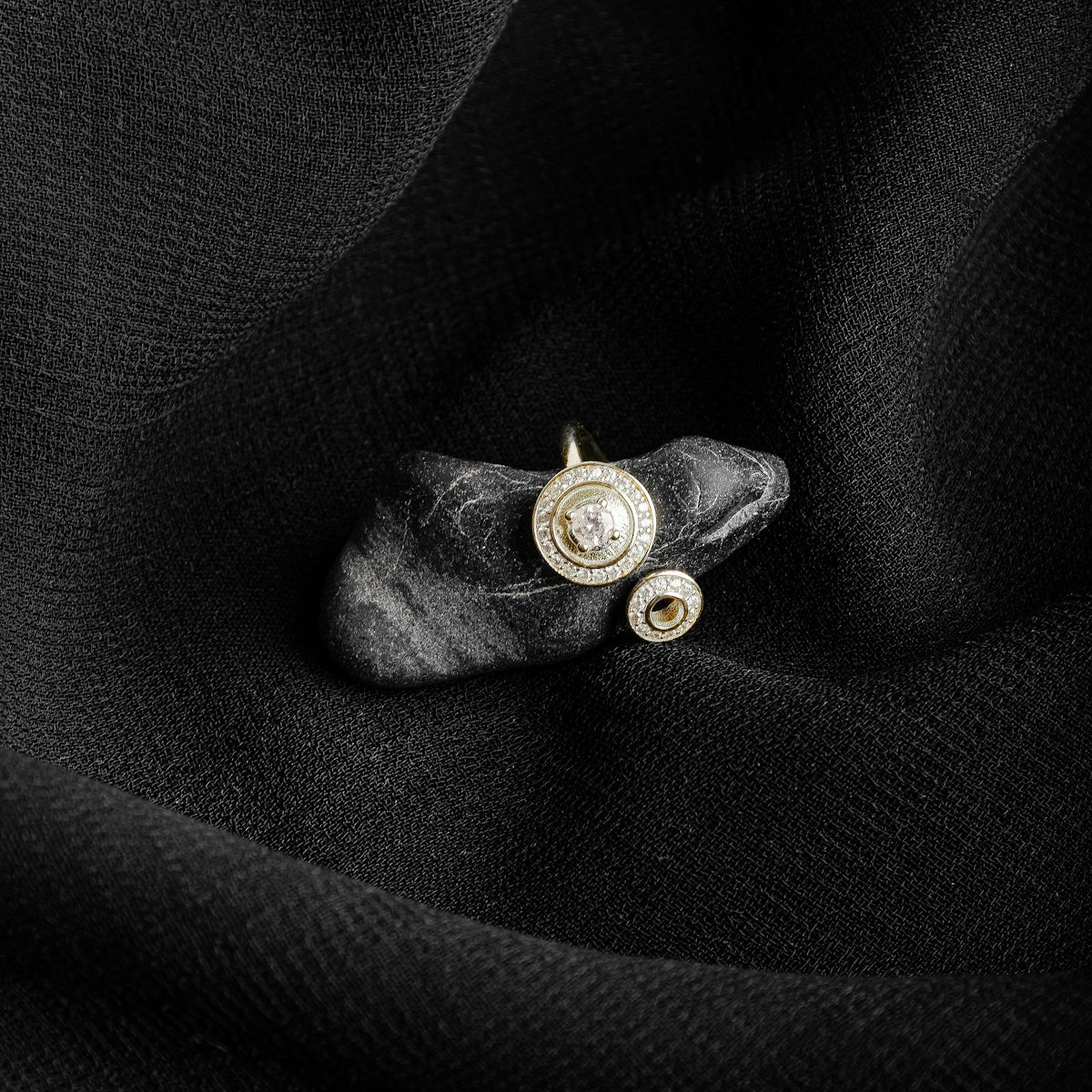 gold and silver round pendant