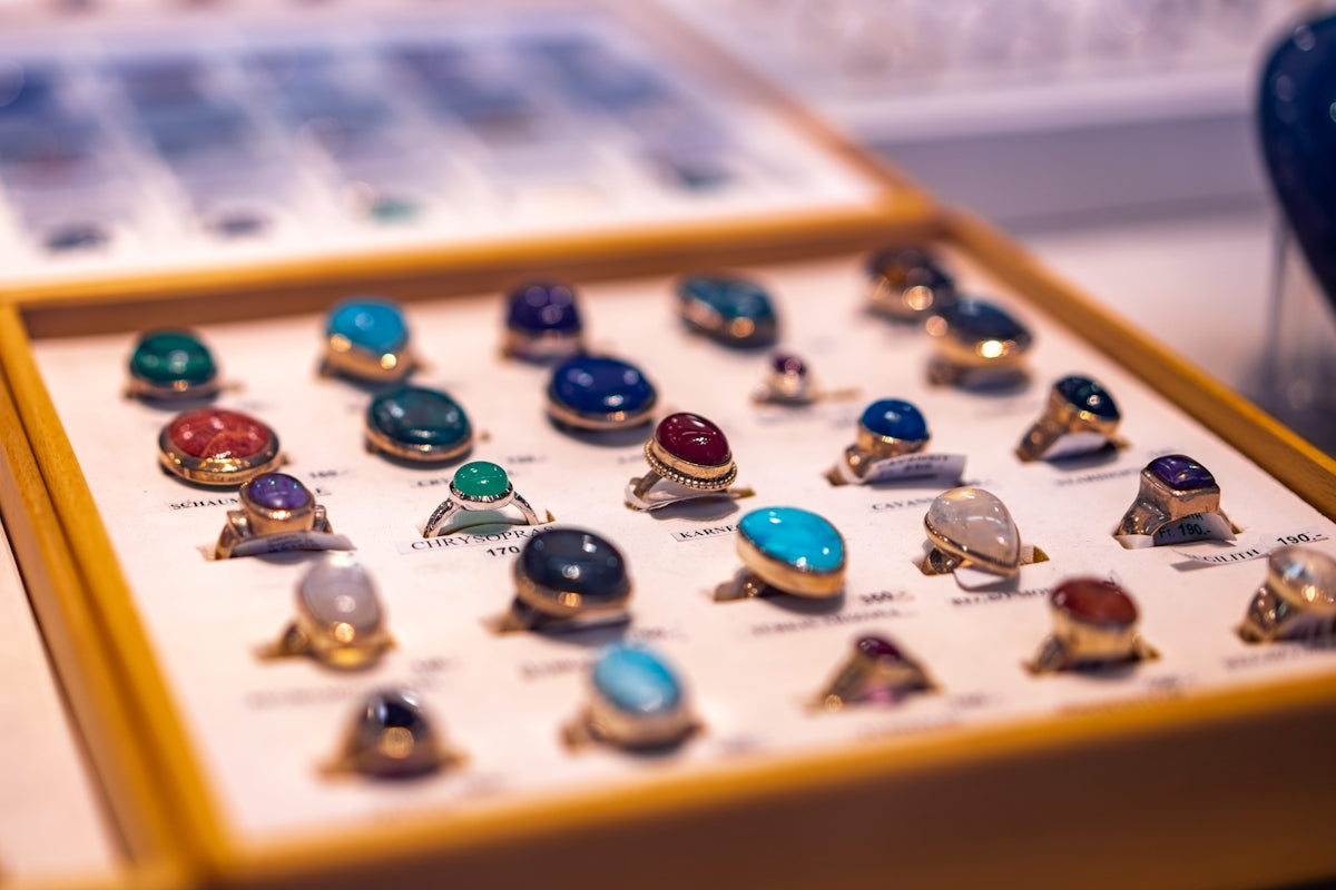 blue and green marble beads on brown wooden board