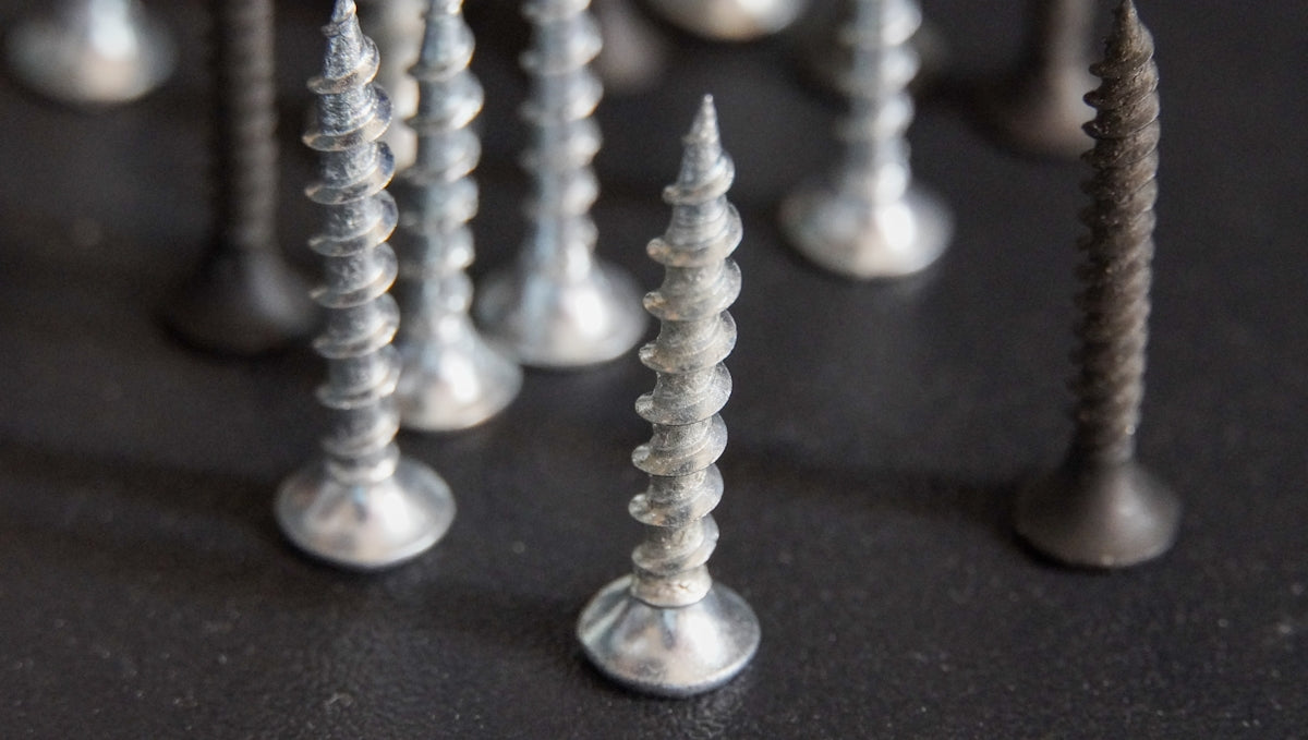 a bunch of screws that are on a table