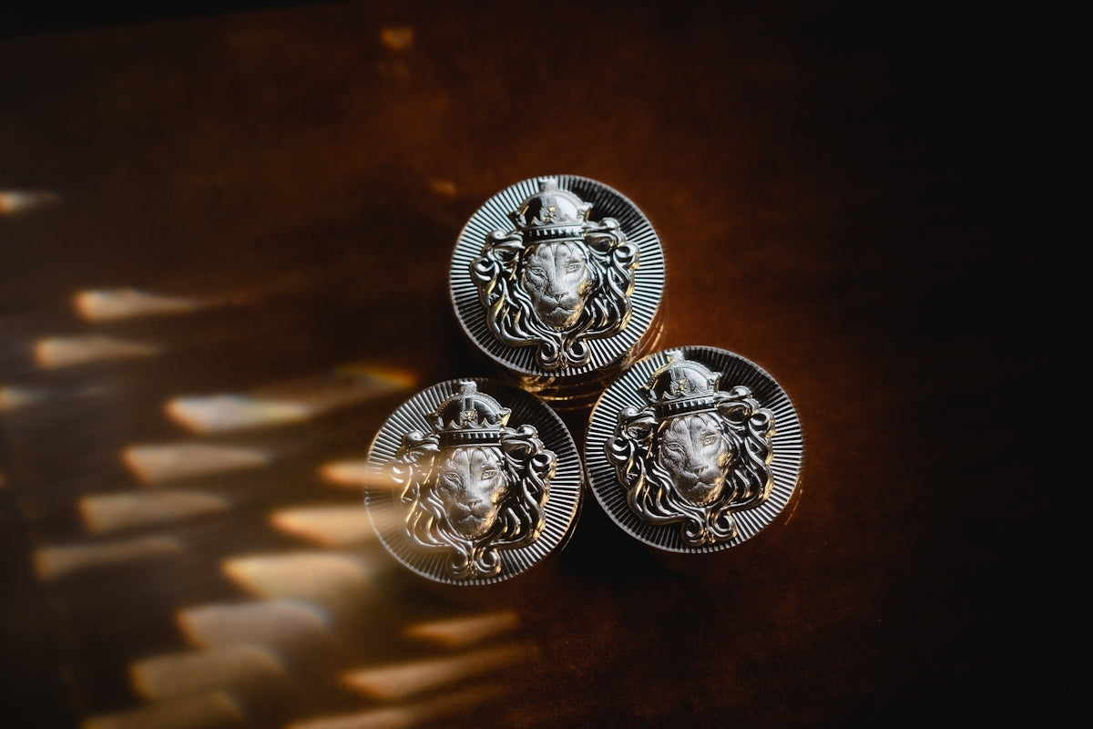 a close up of three metal knobs on a table