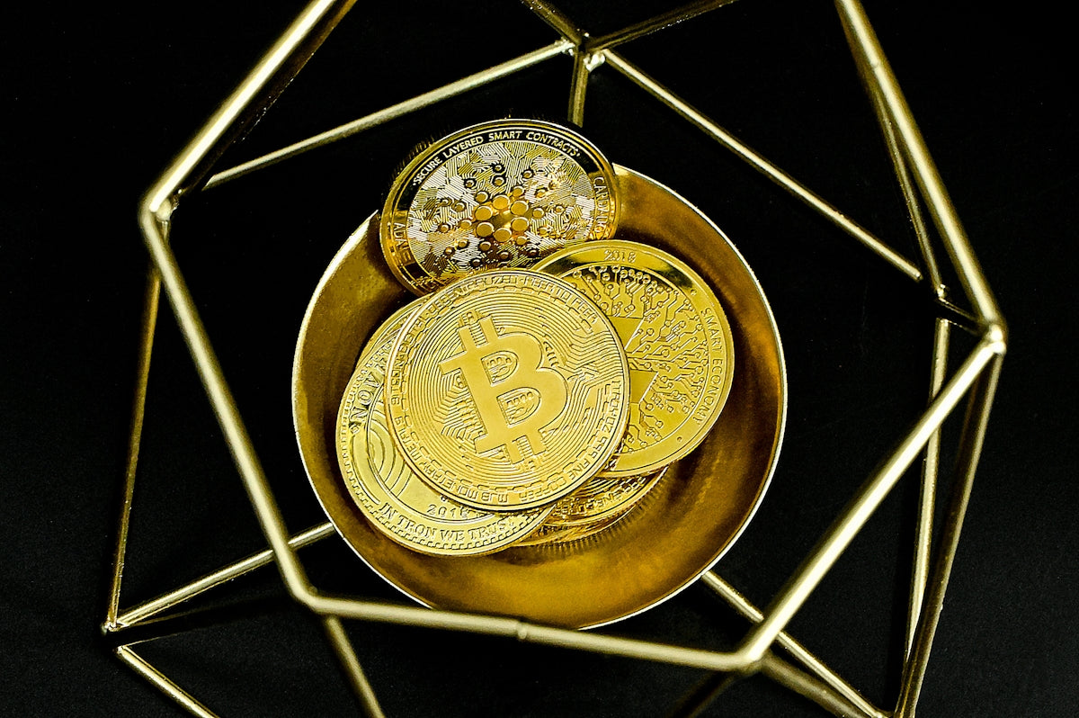 a gold plate with a bitcoin on it