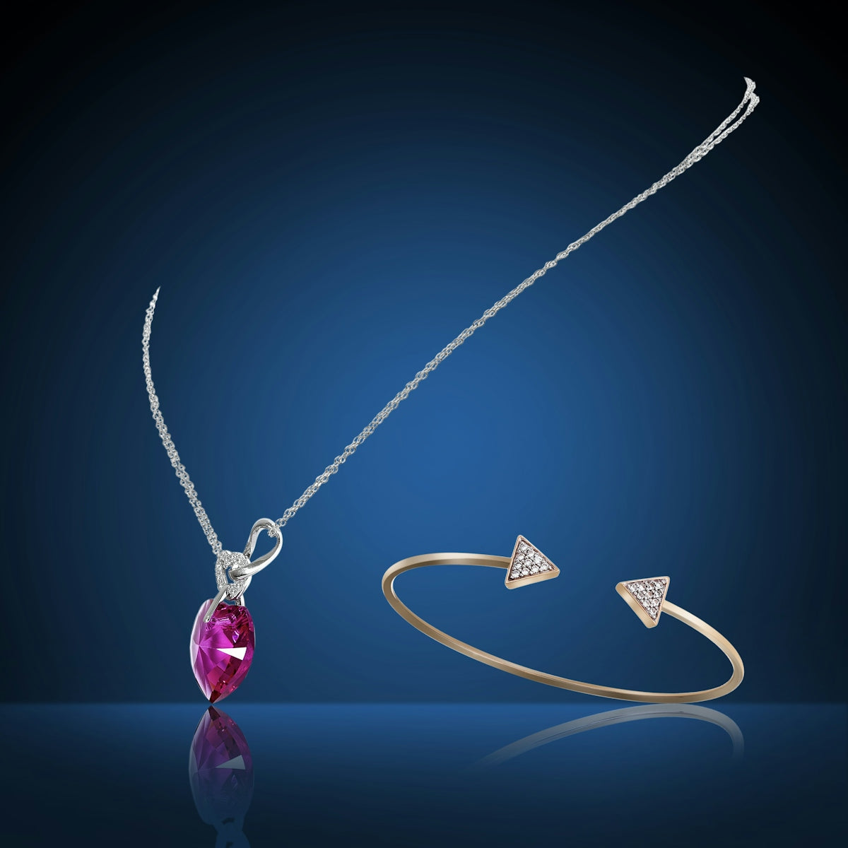 a necklace and bracelet with a pink stone