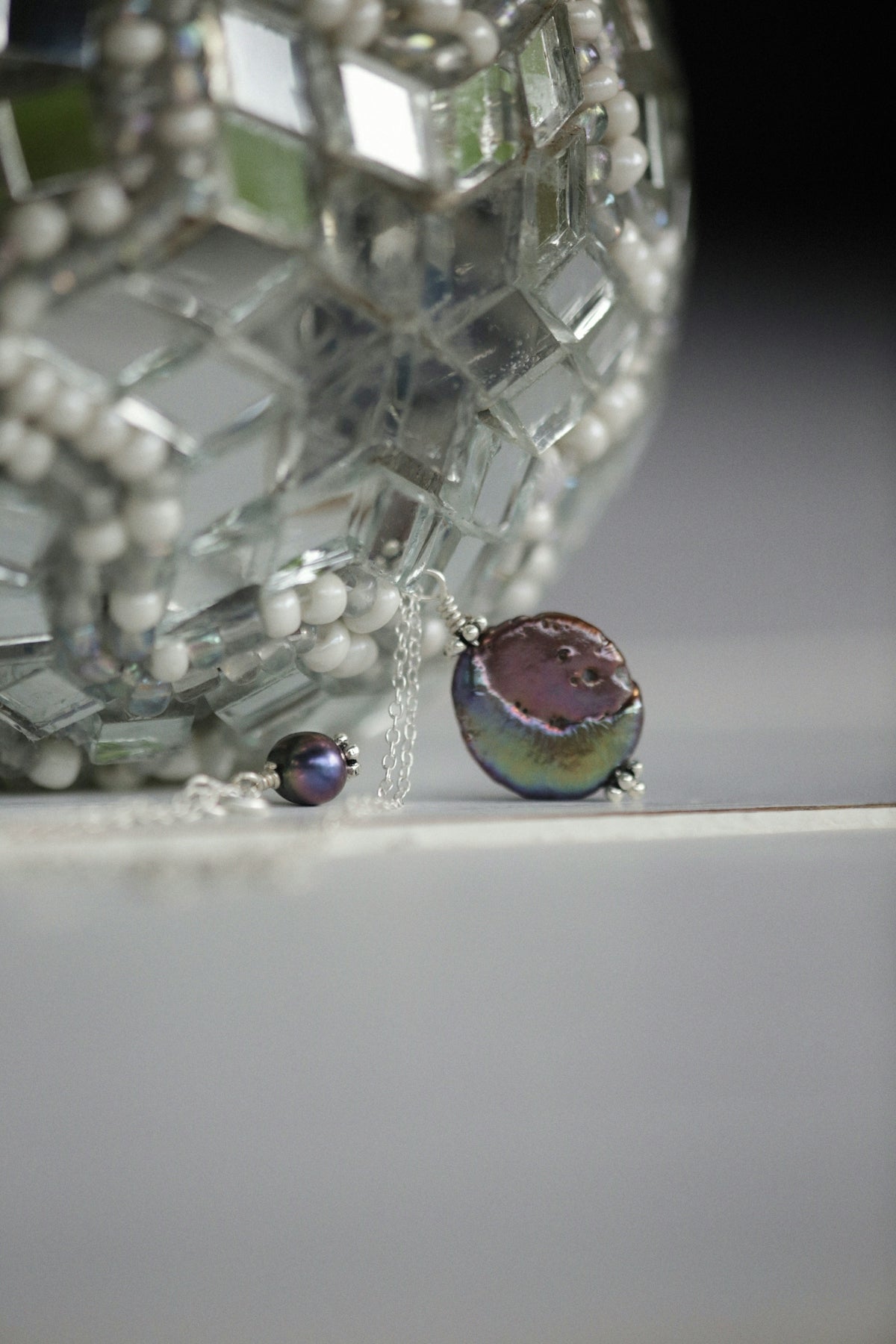 a small turtle on a necklace