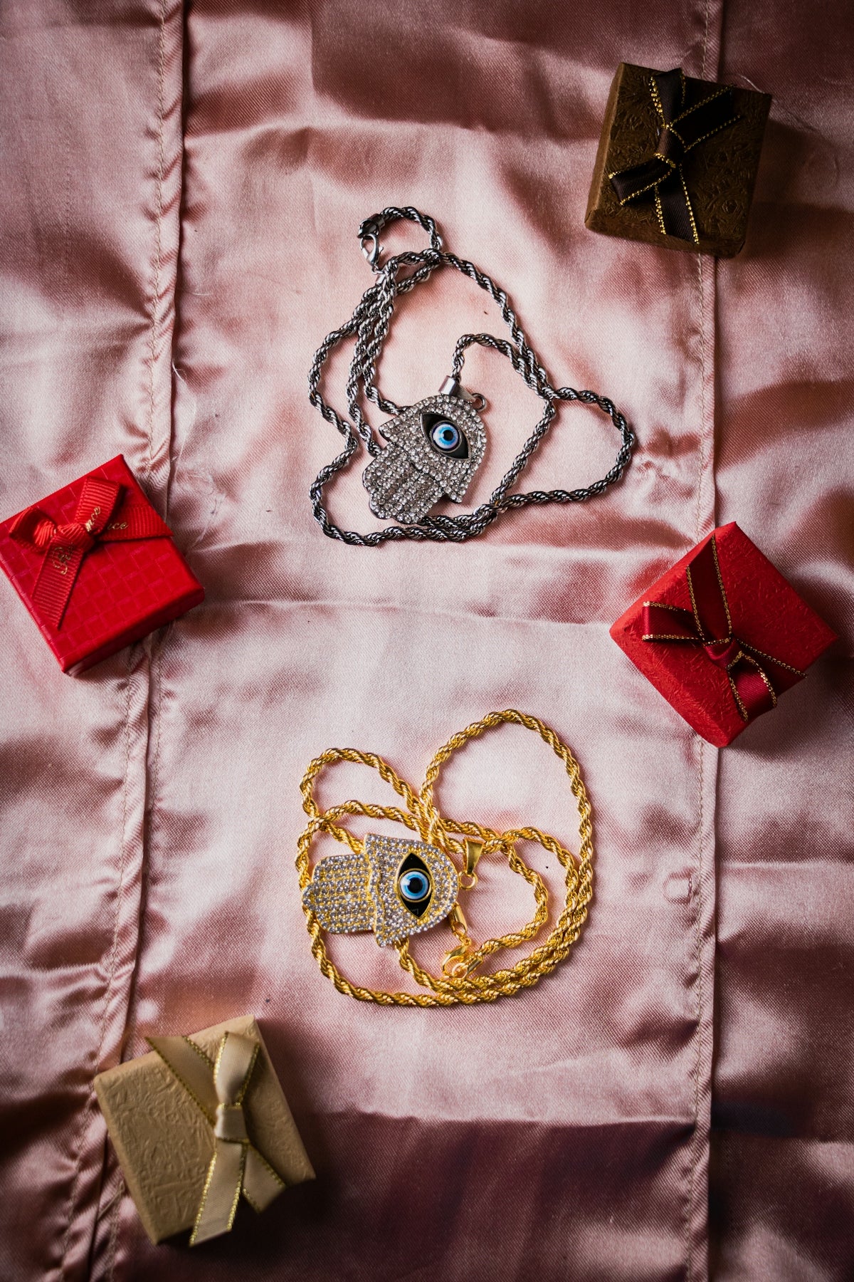 a table topped with lots of different types of jewelry
