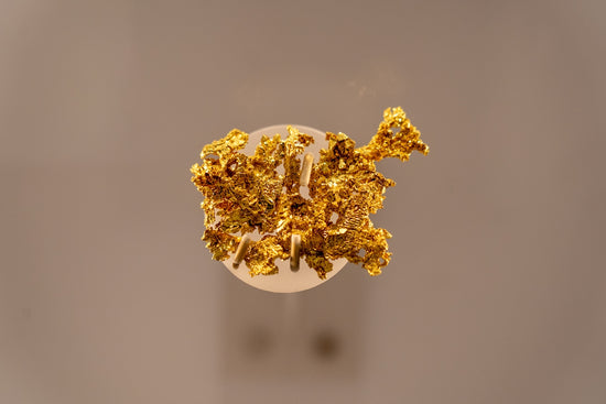 a bunch of gold nuggets sitting on top of a table