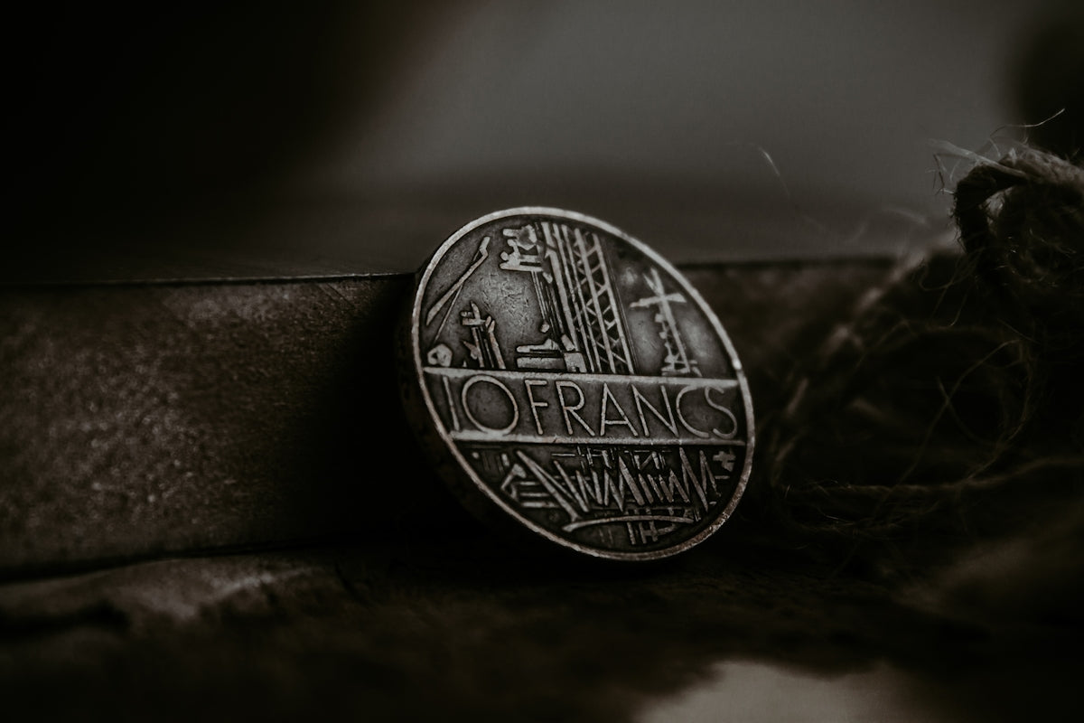 a coin sitting on top of a pile of rope