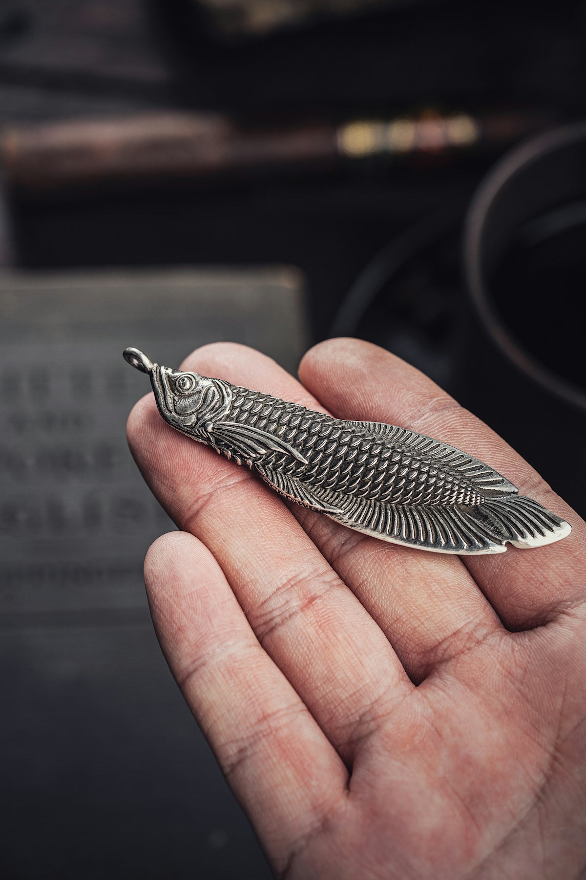 a person holding a metal object in their hand