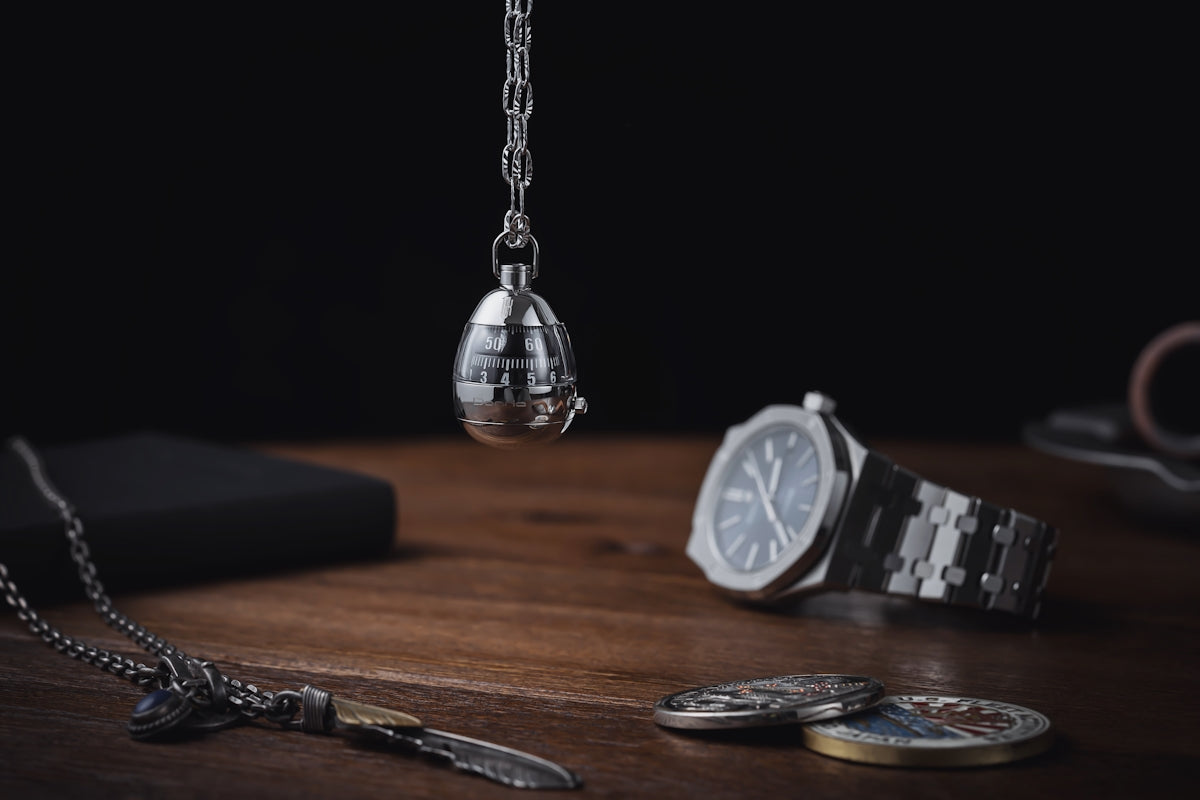 a watch and some other items on a table