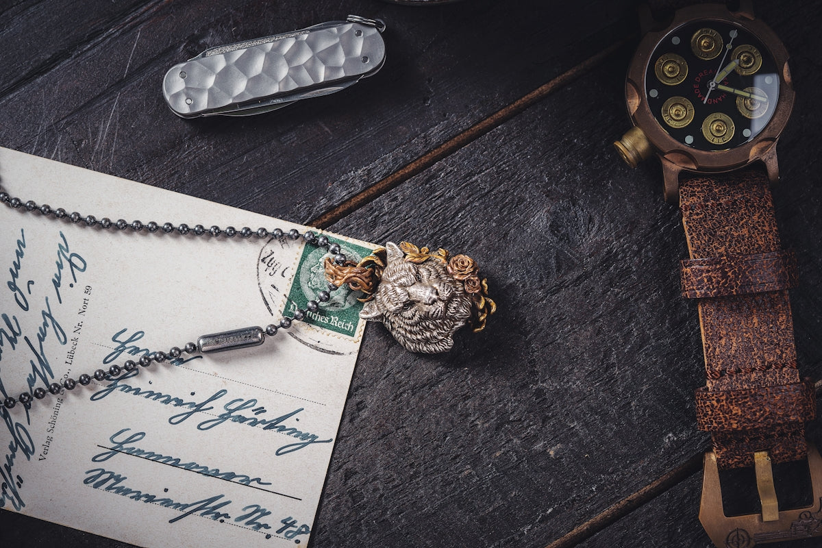 a watch and a piece of paper on a table