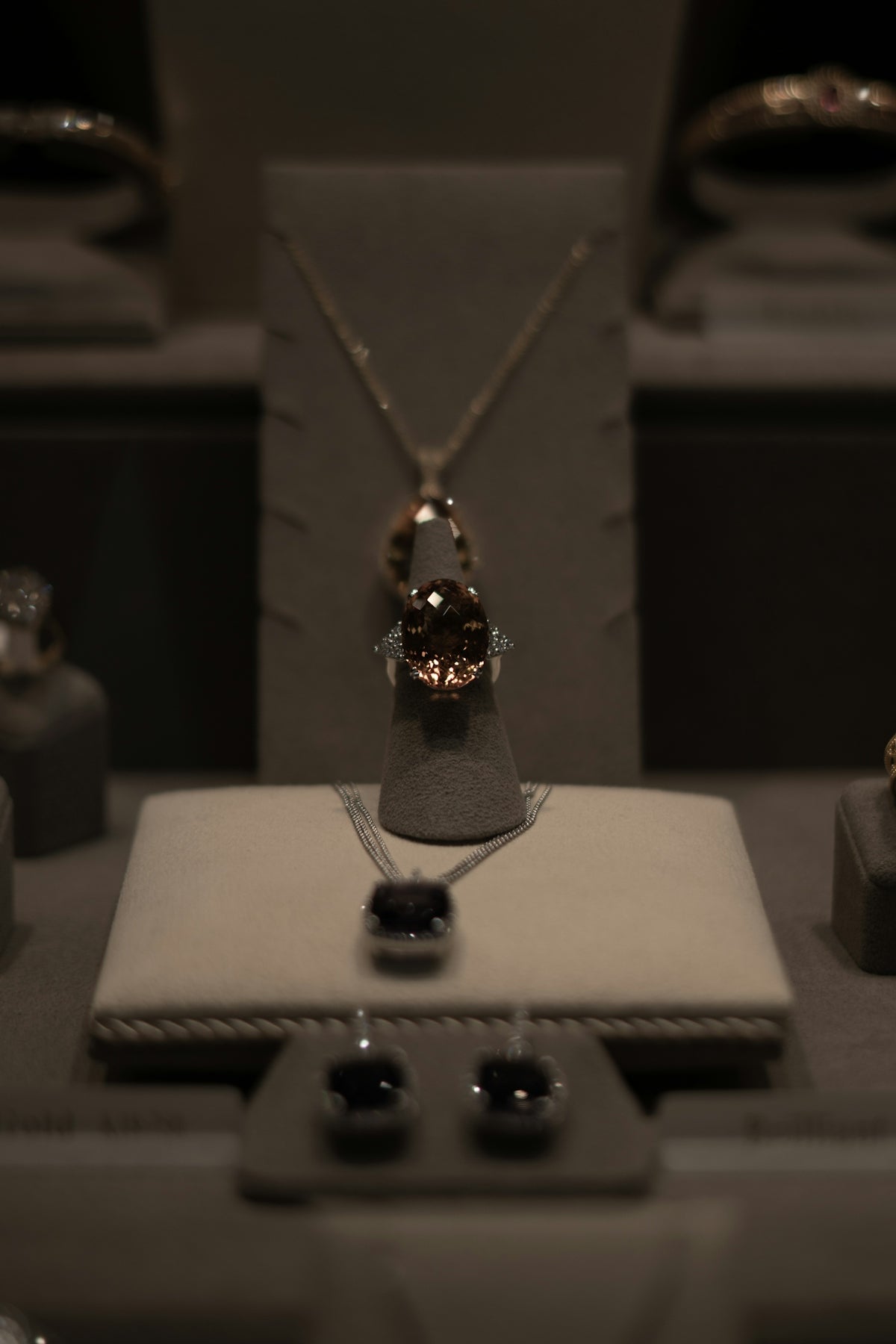 a necklace with a ring on top of it