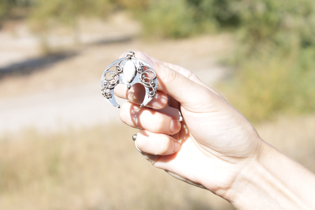 a person holding a ring in their hand