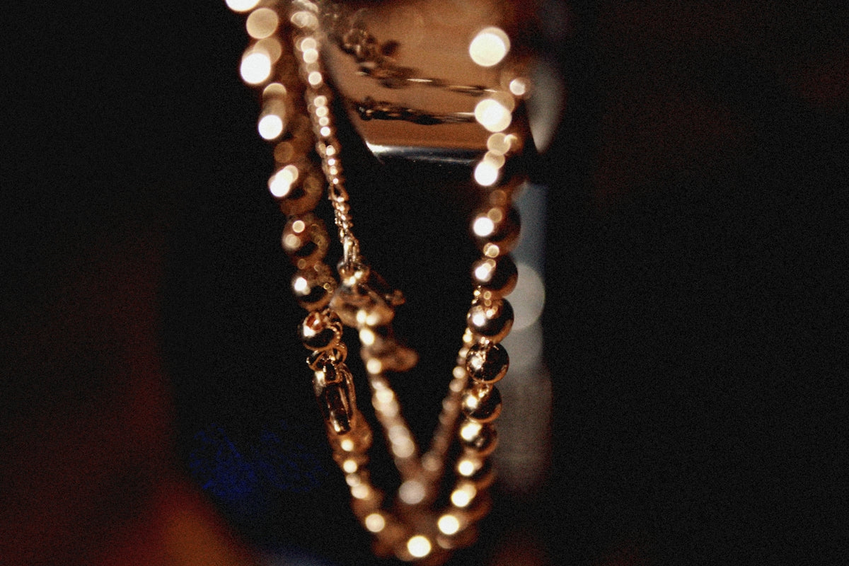 a close up of a necklace on a table