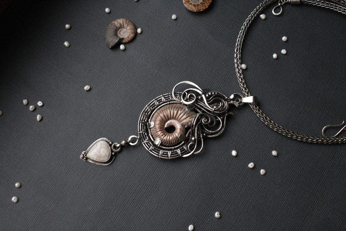 a close up of a necklace on a table