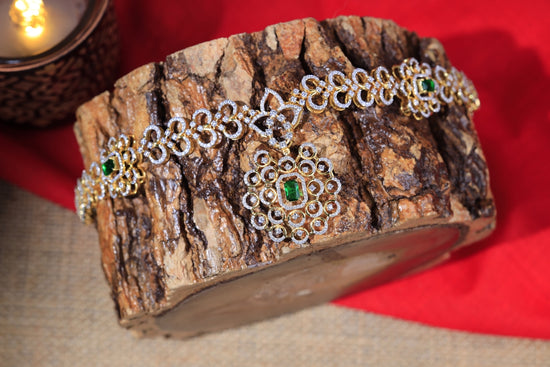 a close up of a bracelet on a piece of wood