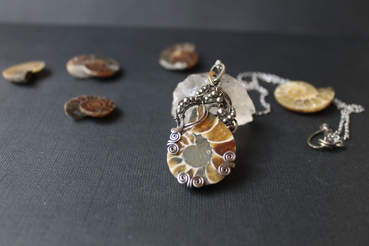 a close up of a necklace on a table