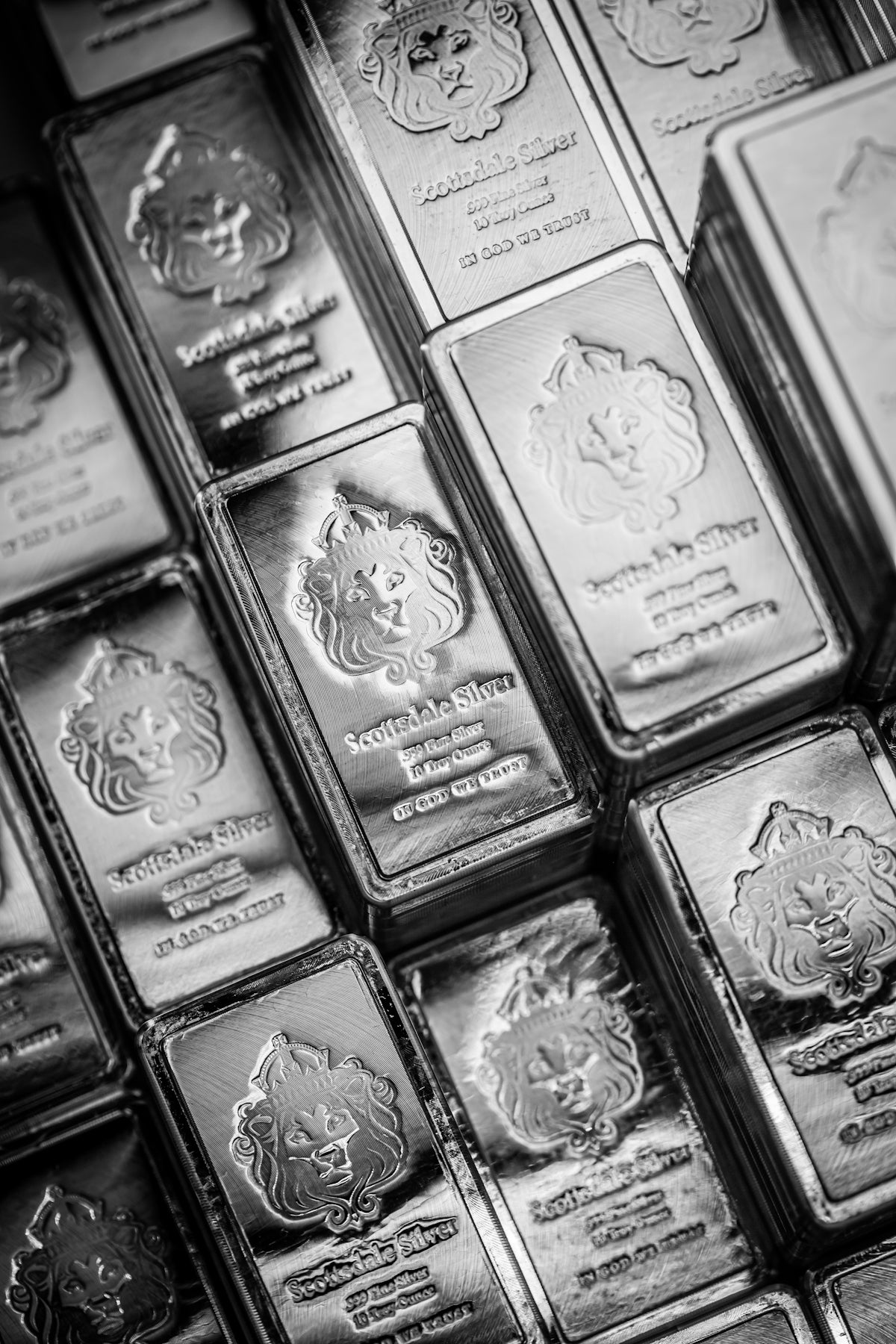 A bunch of silver bars stacked on top of each other