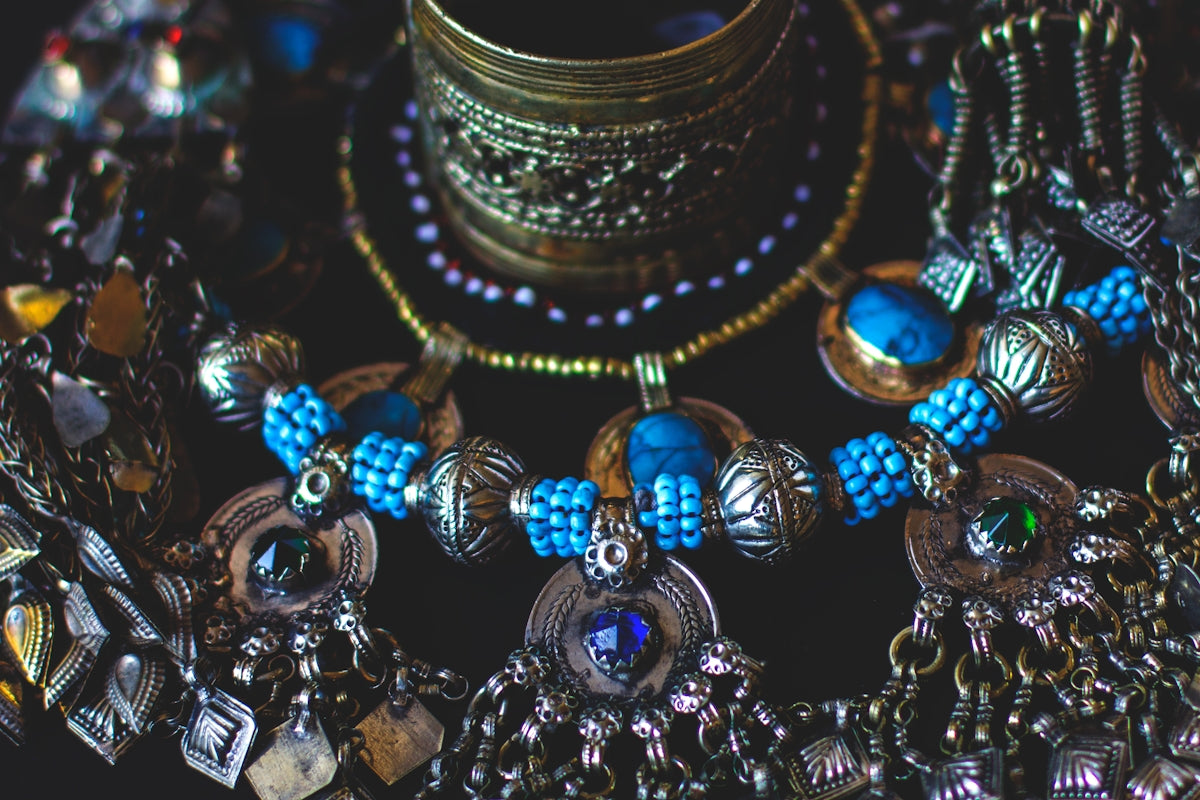 A bunch of necklaces that are on a table