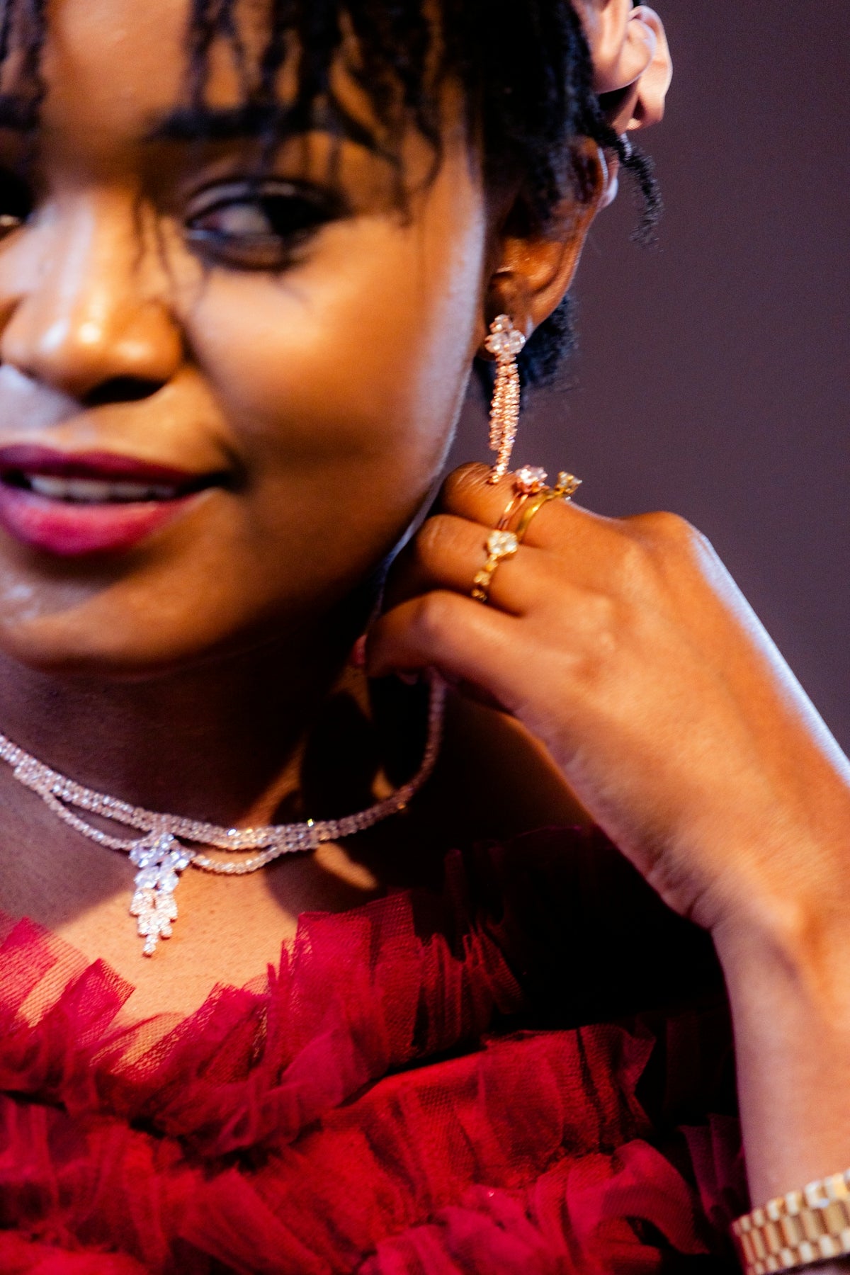 A woman shows off her beautiful jewelry.