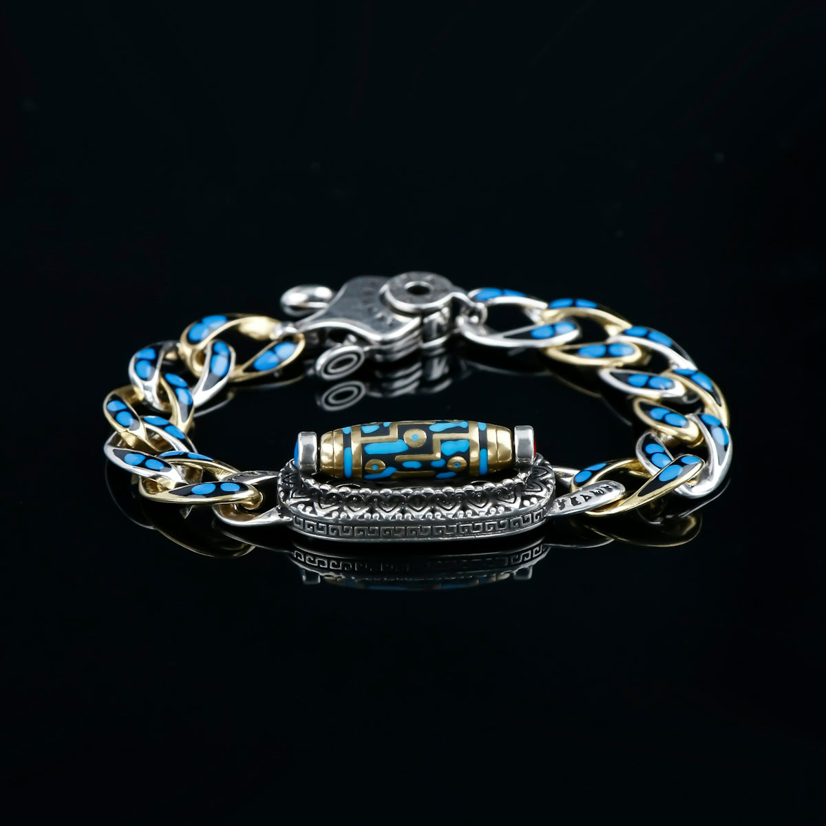 A silver bracelet with blue gemstones.