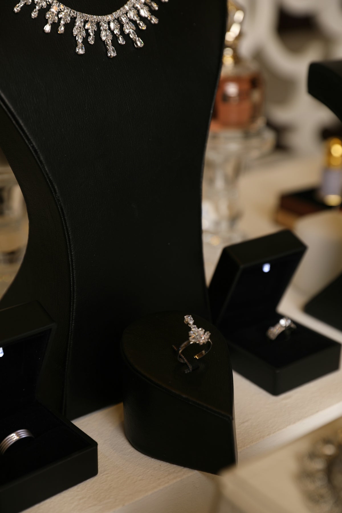 Jewelry is beautifully displayed in black boxes.
