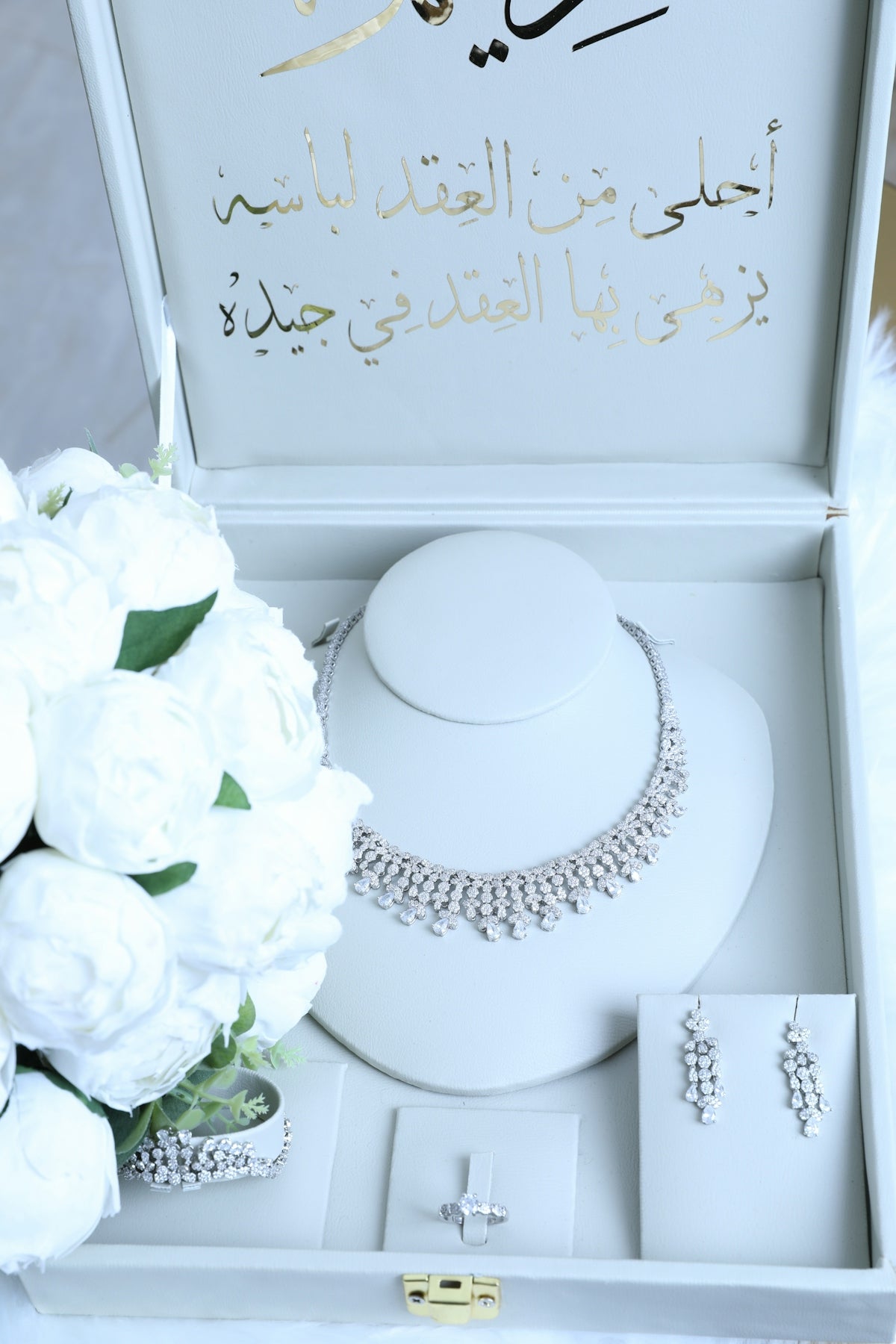 Elegant jewelry set displayed in a decorative box.