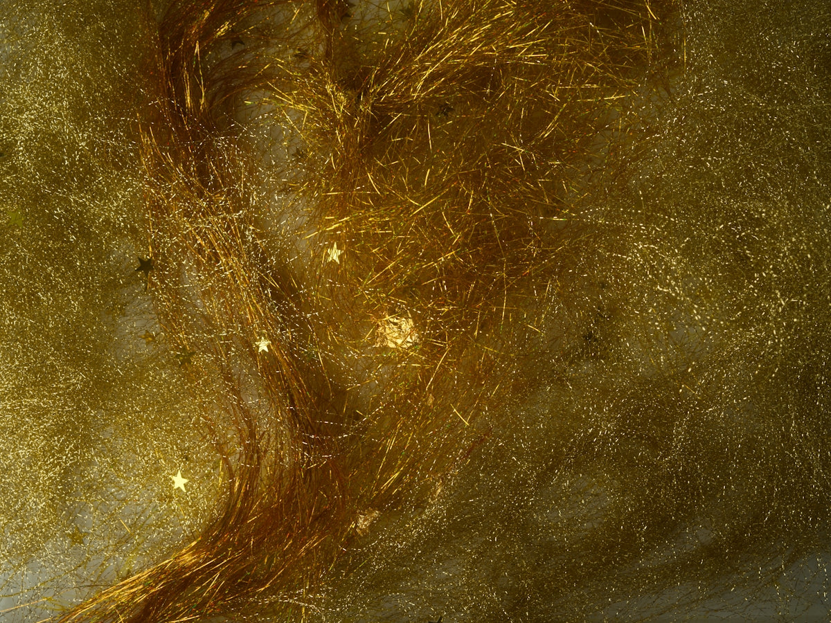 Abstract golden strands with sparkling highlights