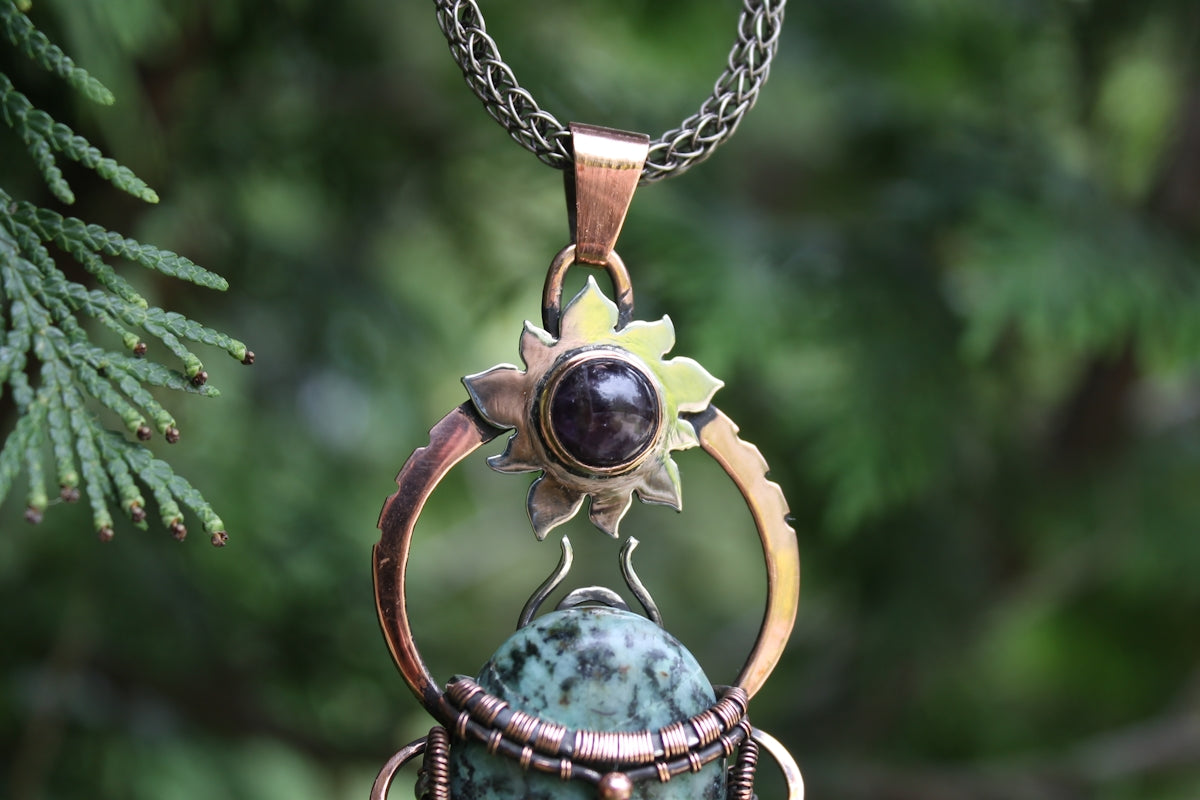 Handmade pendant with turquoise and bronze details