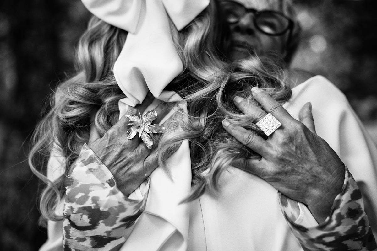 Woman with large bow and statement ring