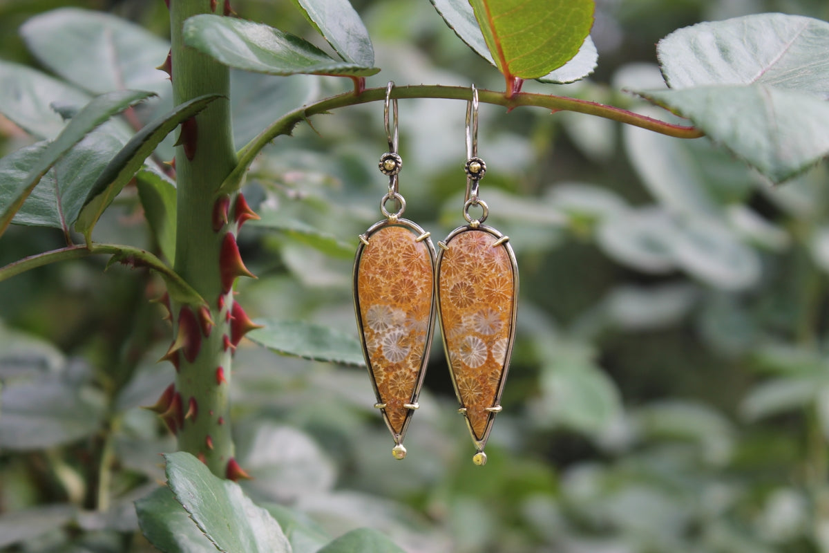 Dangling earrings with coral-like stones on branch