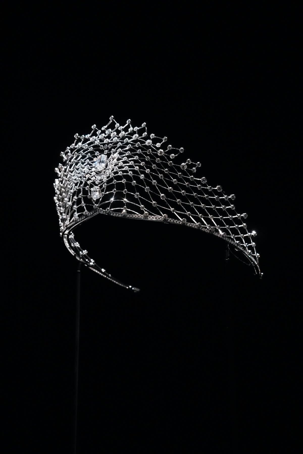 A sparkling diamond tiara on a black background