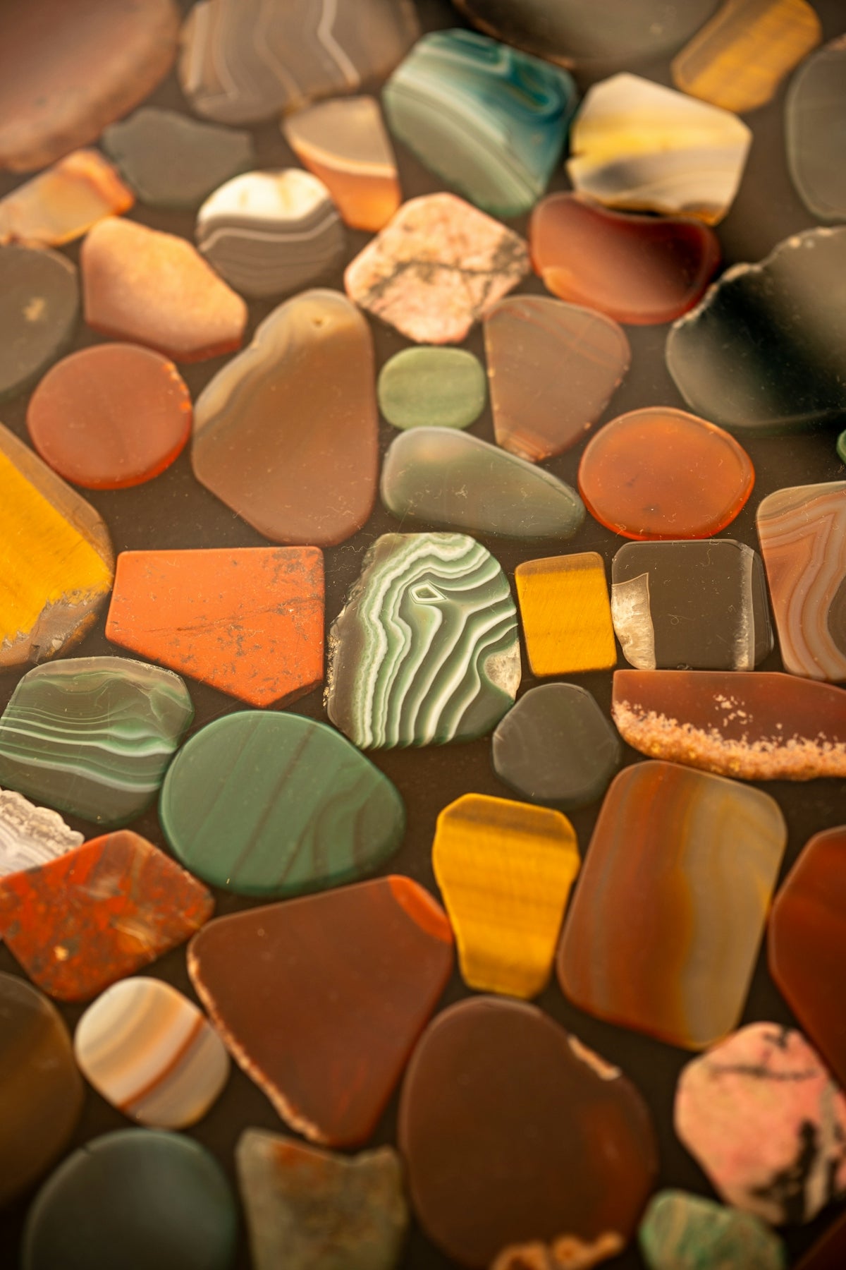 Assortment of colorful polished stones and agates
