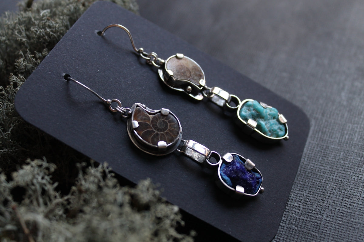 Ammonite fossil and gemstone dangle earrings.