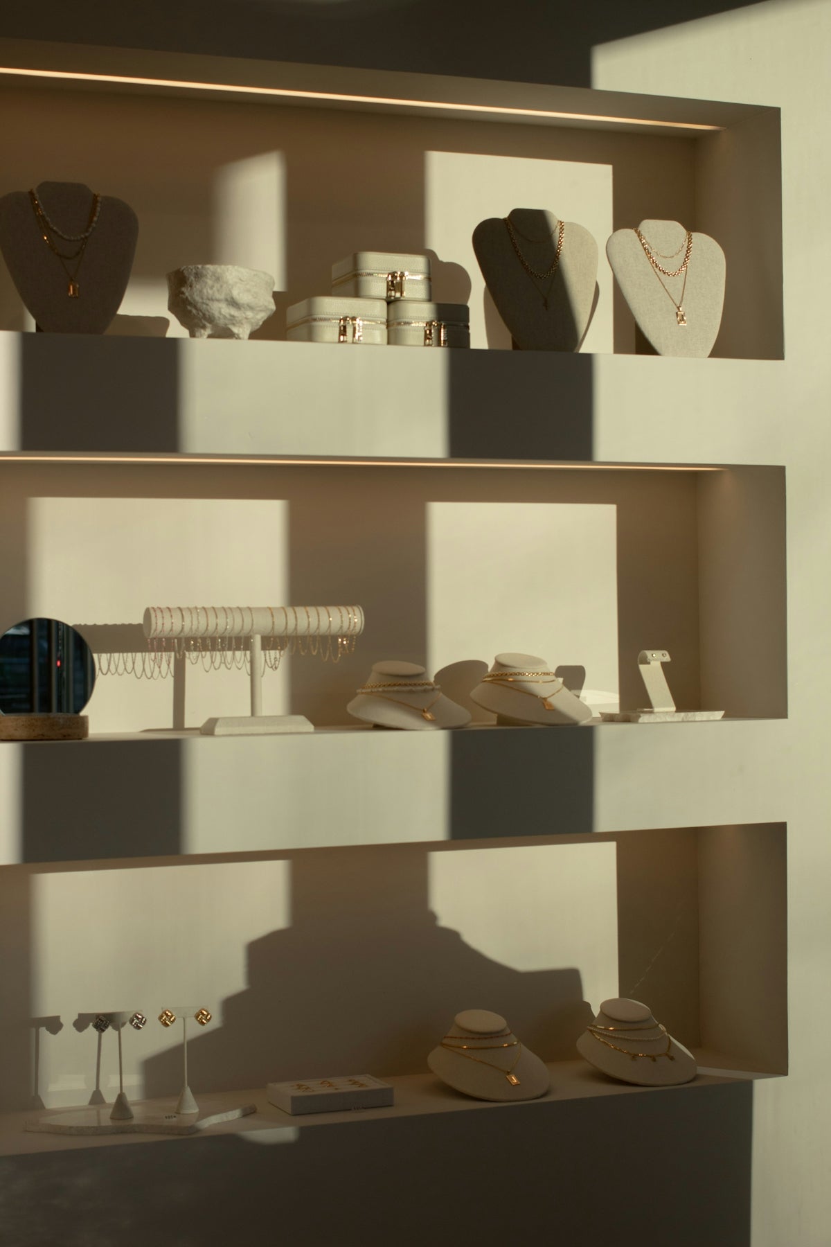 Display shelves filled with elegant jewelry and accessories.