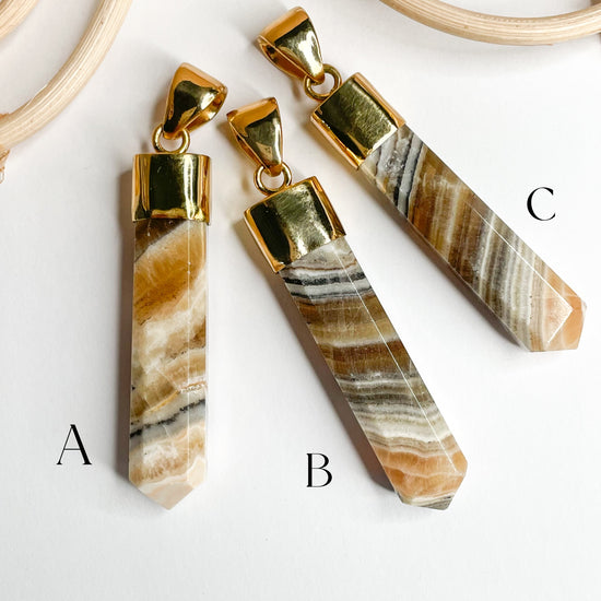 Load image into Gallery viewer, Brown Aragonite Point Pendants - Alchemia
