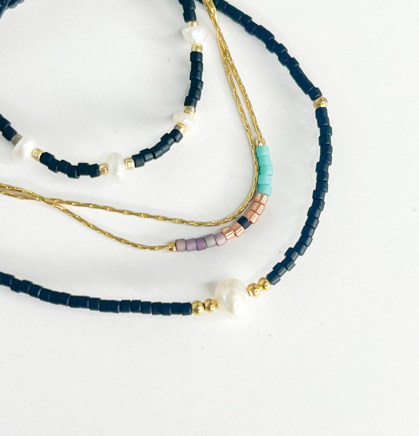 Black Pearl Rope Stack w Blue, White, Gold Bracelet